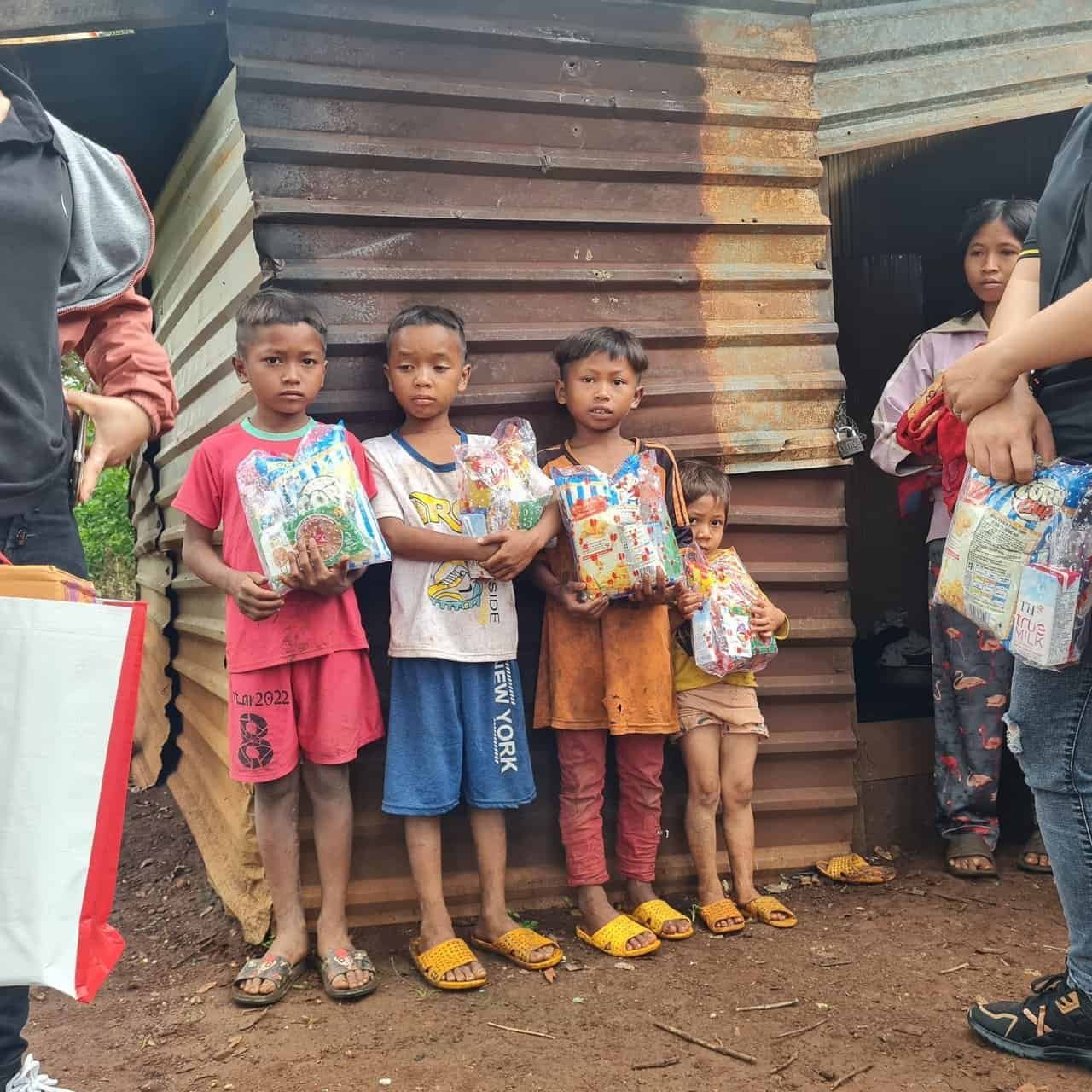 The boy in the red had a wicked sad story, his sister is the little one on the right, both were victims of gangs who burth they legs in a fire