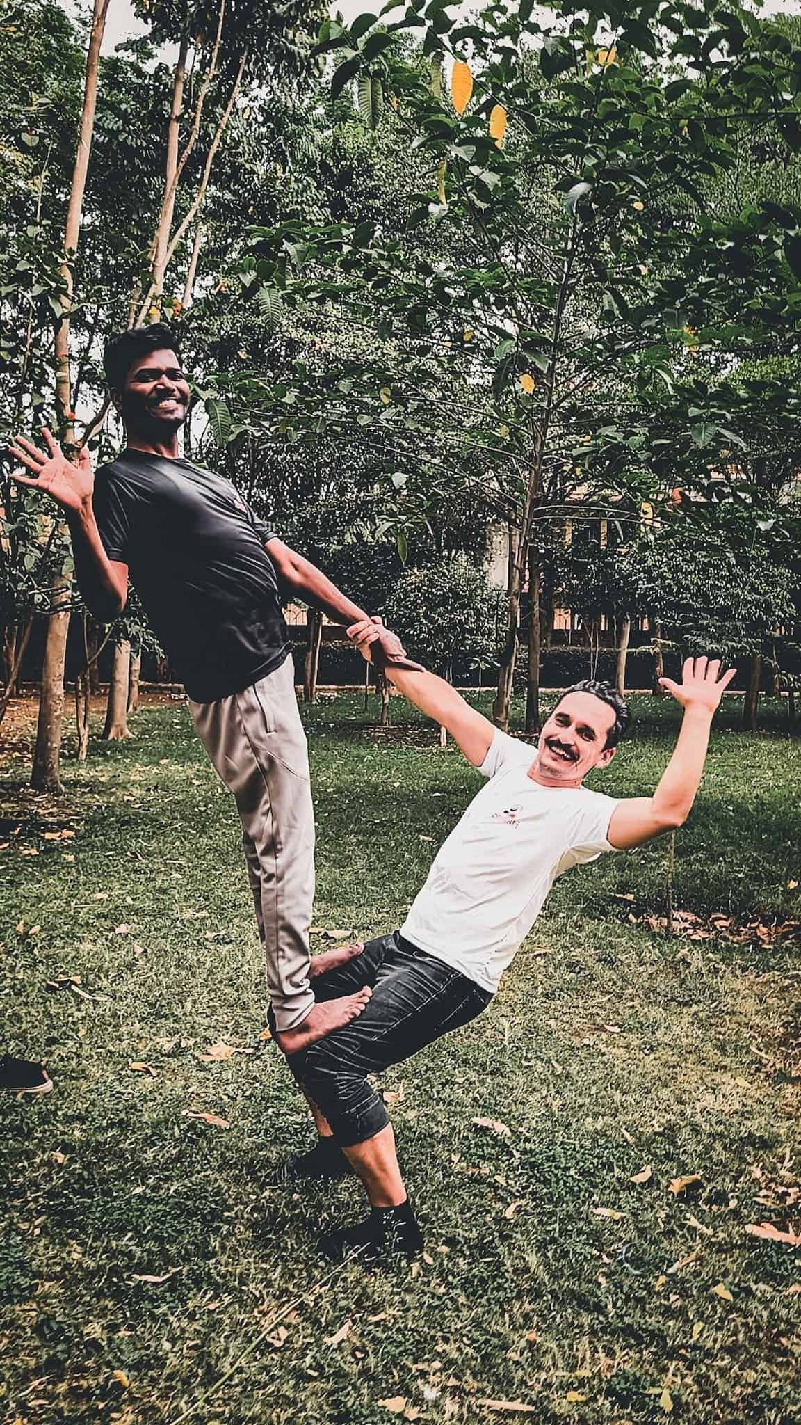 A yoga workaway in india: my month in pune 12 » 2026 » roaming sparrow AcroYoga in a Pune park, balancing a friend from the yoga center on my feet
