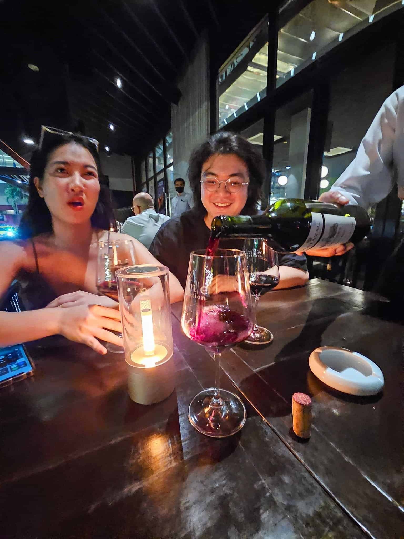 Lasers and crowds inside a large Bangkok nightclub