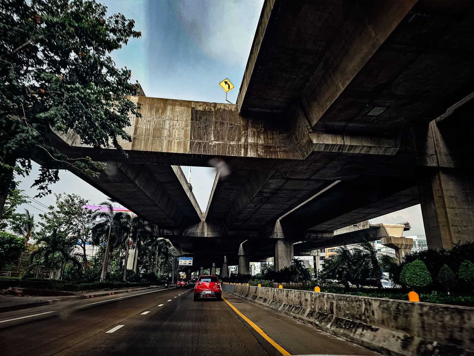 Bangkok's layered highways, rail lines, and skyscrapers at dusk