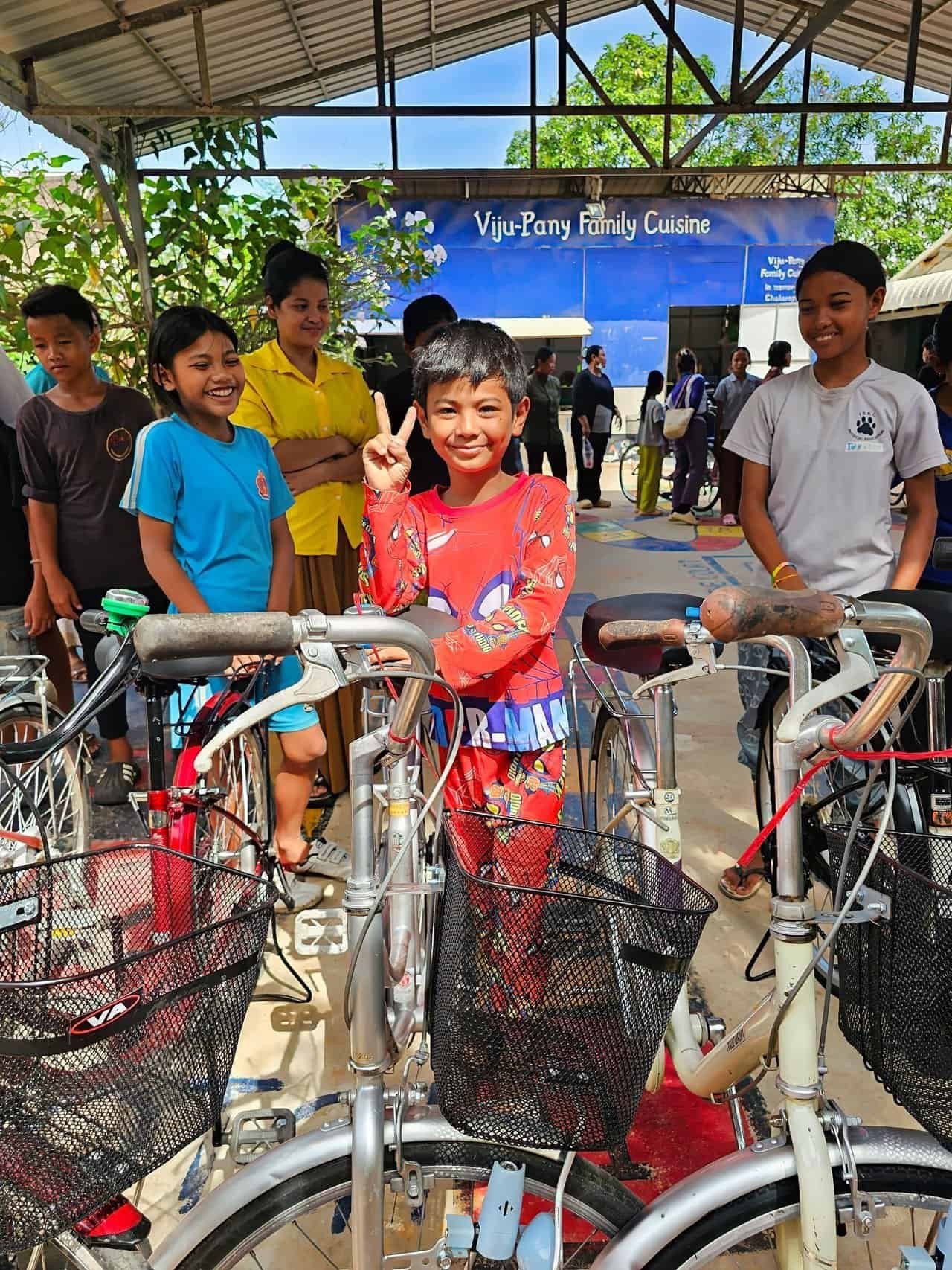 Bikes for cambodian kids: 26 bikes built on pure grit 9 » 2026 » roaming sparrow Spider man (kid) giving the peace sign when he got his new bike!