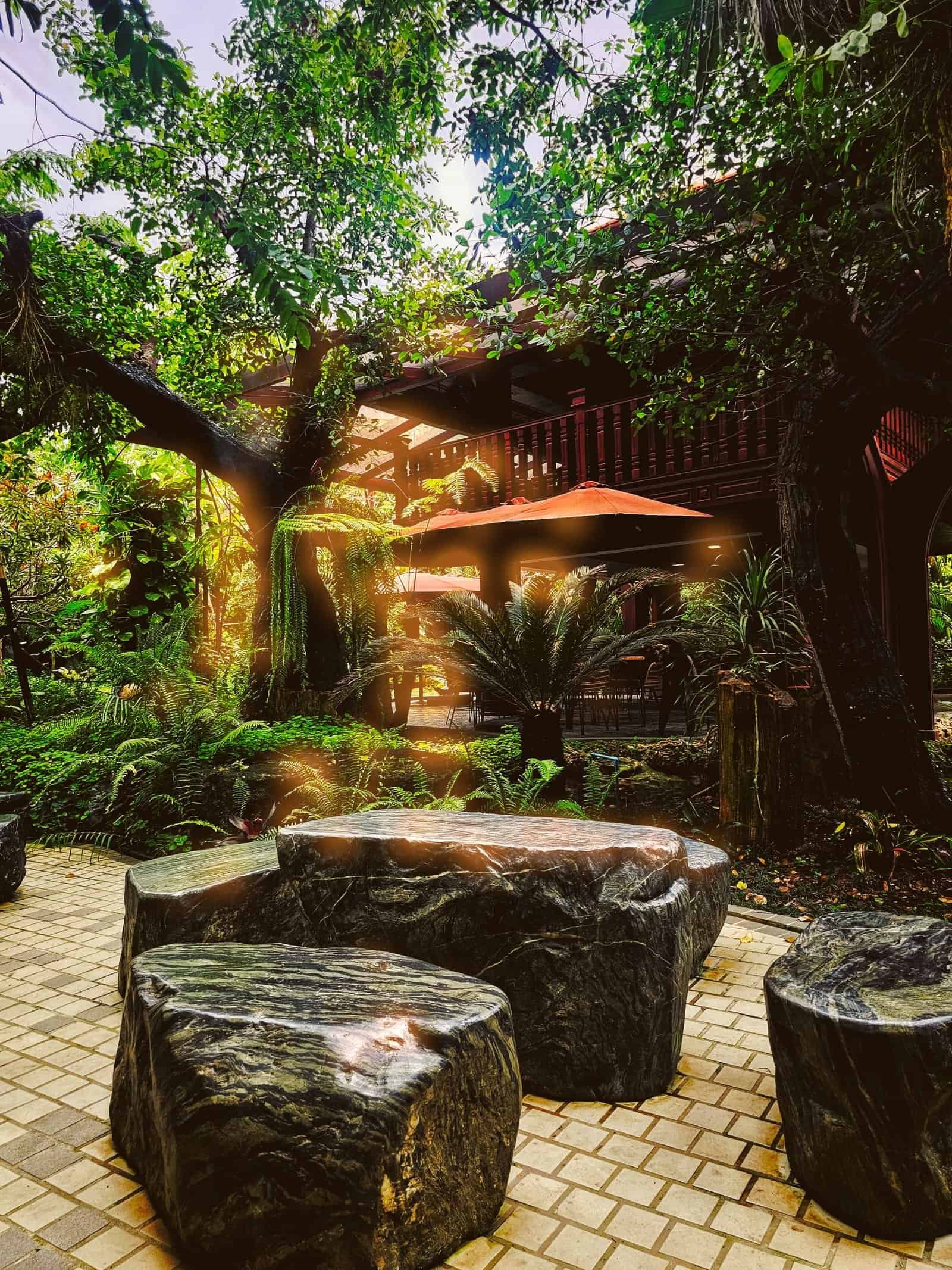 Stepping stones over a small stream in the garden at Chesda, Siem Reap