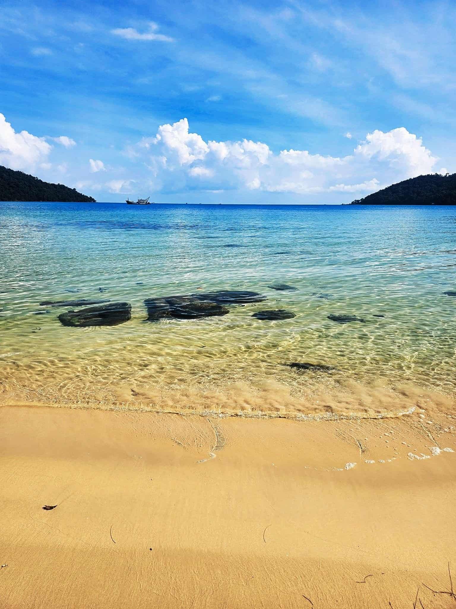 Getting sick on koh rong sanloem: island life unfiltered 17 » 2026 » roaming sparrow Crystal-clear shallow water over pale sand at Koh Rong Sanloem