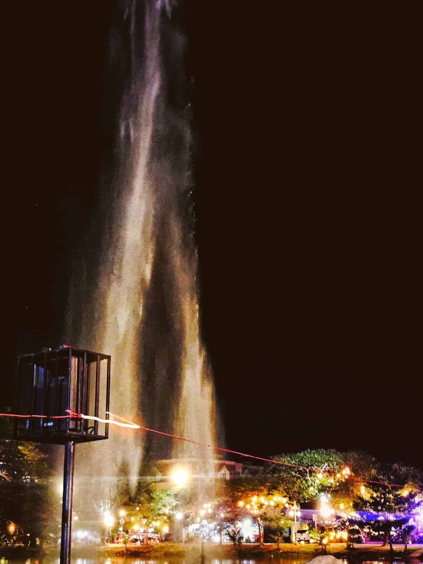 The Siem Reap River fountain water jets lit up at night