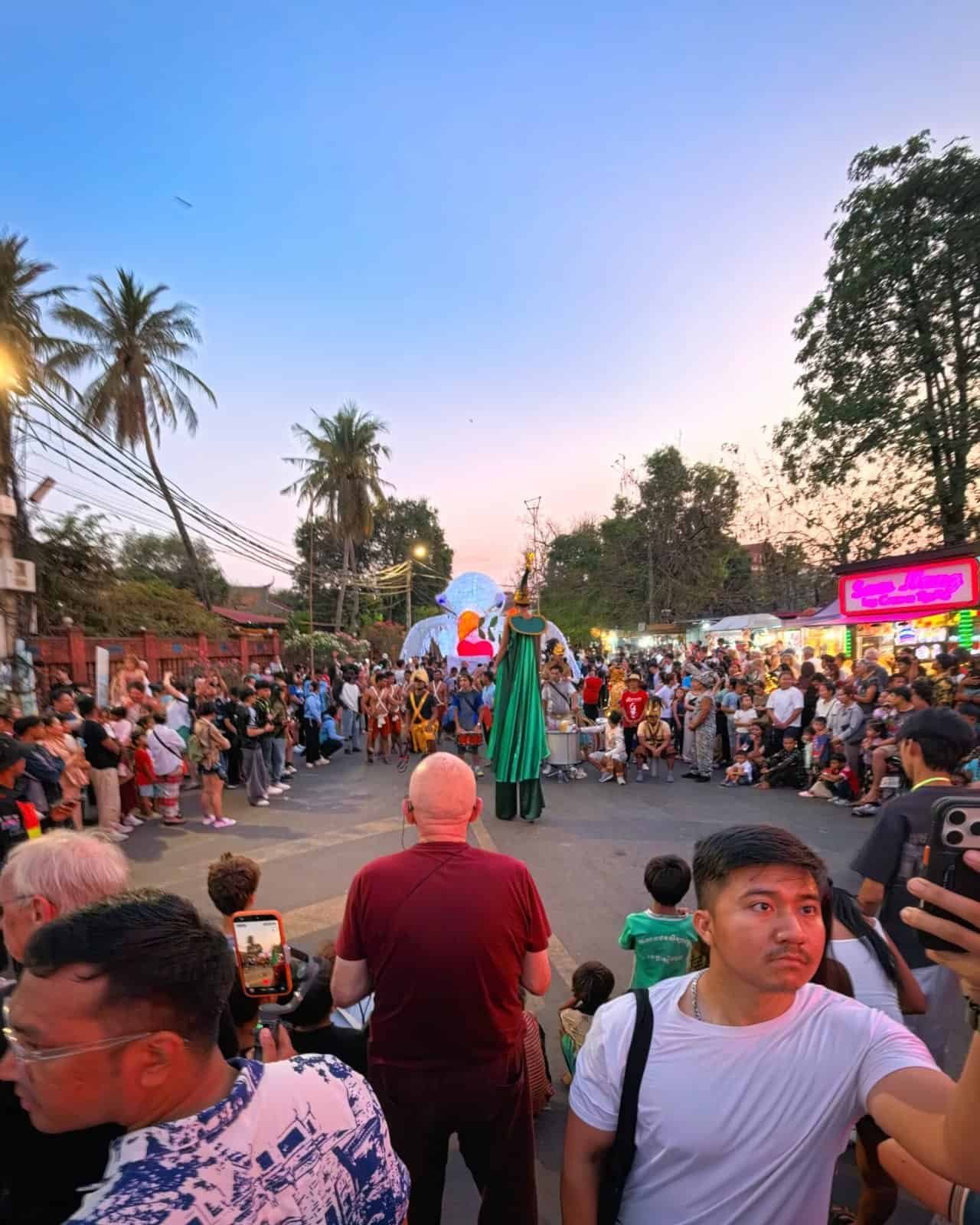 Siem reap giant puppet parade: 8 wild glowing creatures hit the streets 12 » 2026 » roaming sparrow Crowds gathering at the start of the Siem Reap Giant Puppet Parade near Wat Damnak