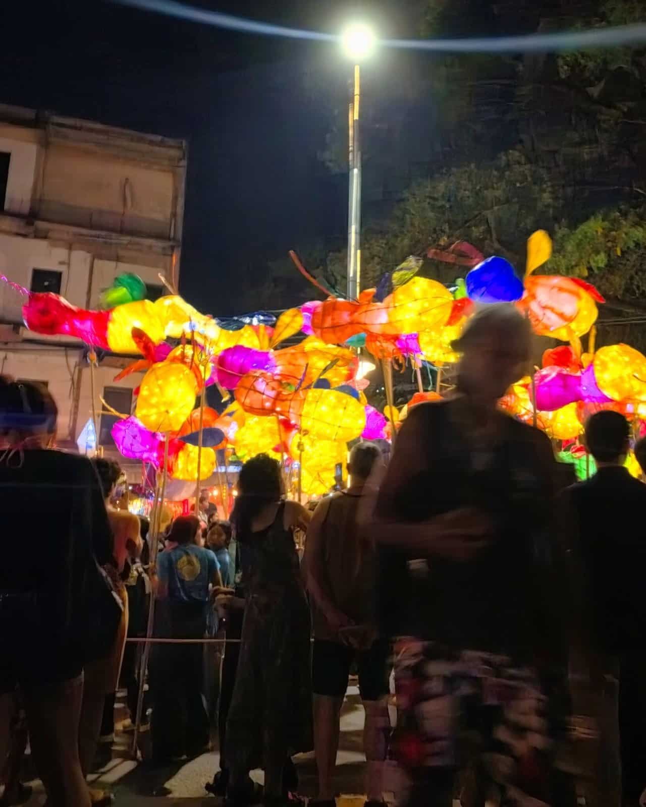 Siem reap giant puppet parade: 8 wild glowing creatures hit the streets 15 » 2026 » roaming sparrow Children marching with instruments during the Siem Reap Giant Puppet Parade along the river