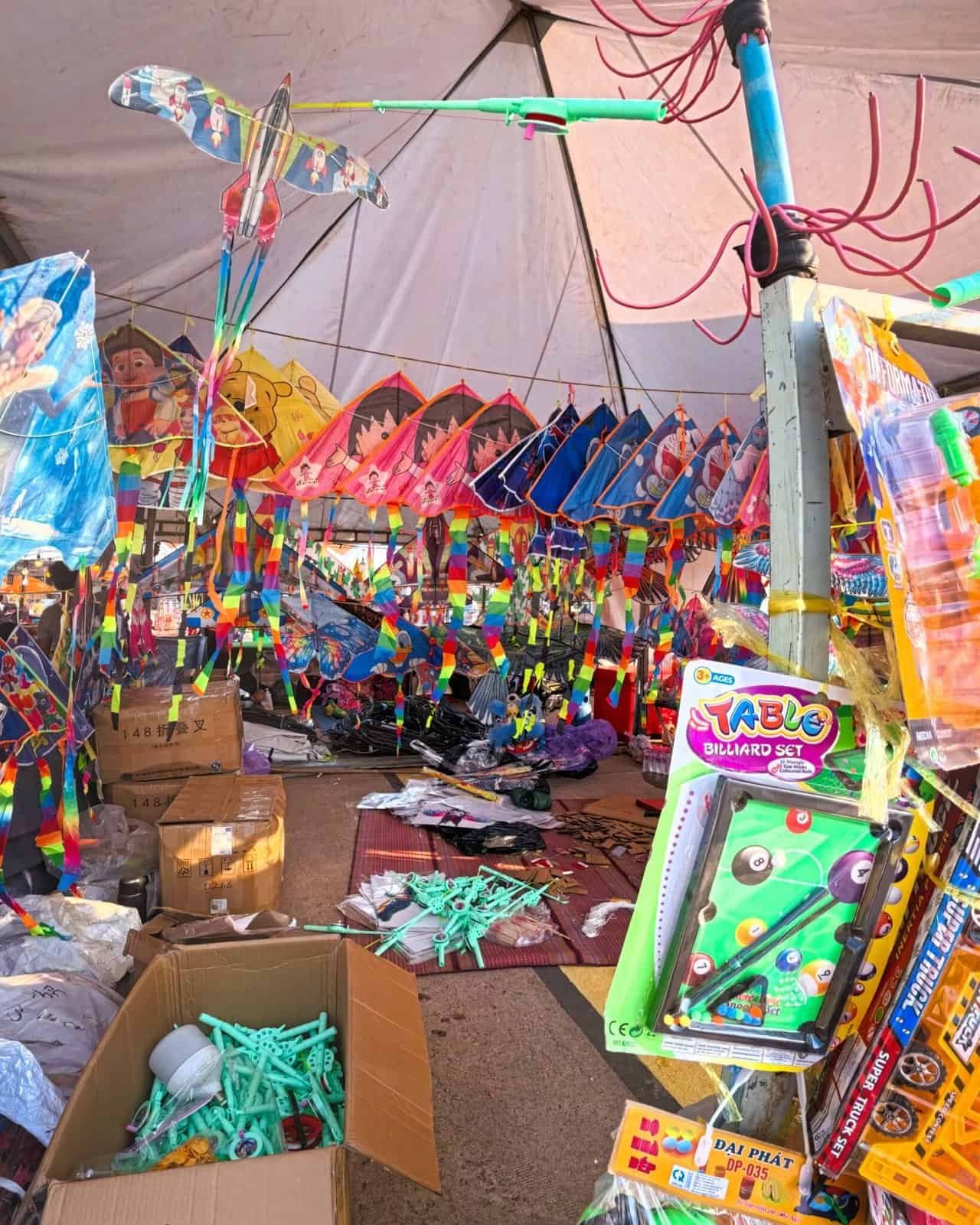 Vendor stalls and kites at the Siem Reap Kite Festival